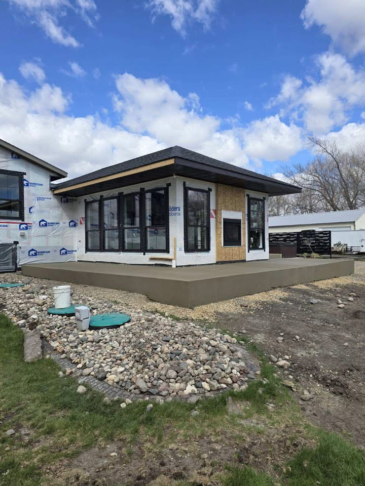 Finished concrete porch and patio slab at a new lake build